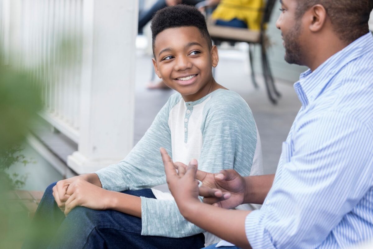 Adoptive parent talking to adoptee child