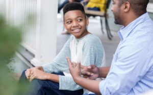 Adoptive parent talking to adoptee child